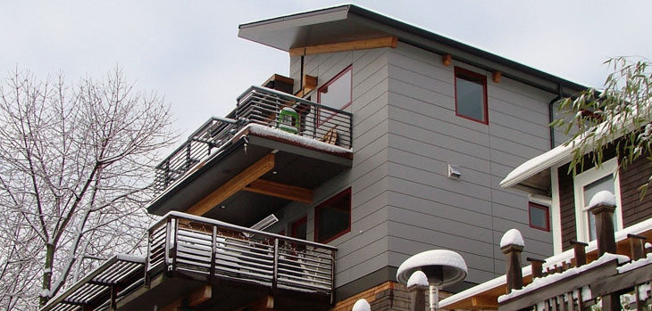 sustainable modern home exterior with cedar siding and hardie panel rainscreen
